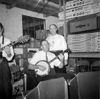 1960 Jesse K Hagemeyer Sr playing banjo in his shop